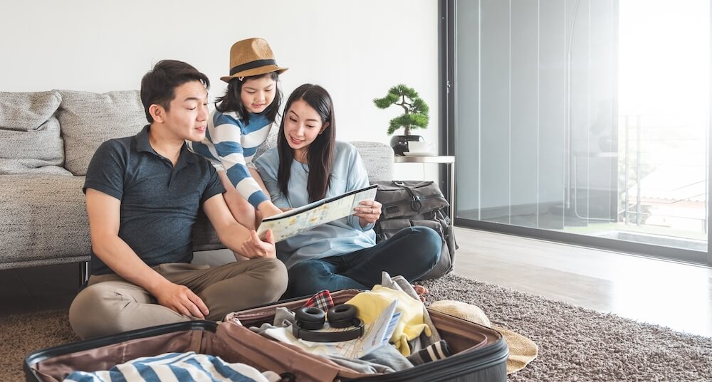 young happy family with device